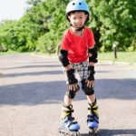 Asian boy learning to skate