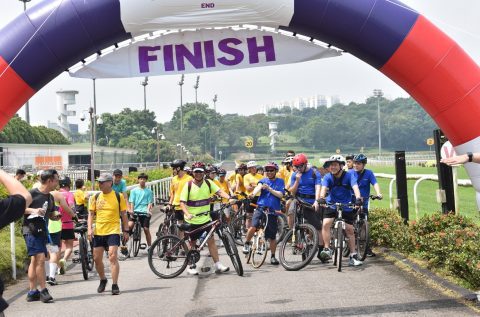 Group of Cyclists at a finish line