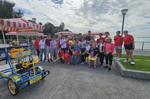 Group photo near tandem bikes